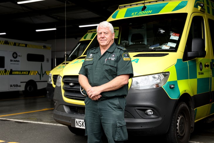 Ambulance officer John Armitt standing in front of his ambulance.